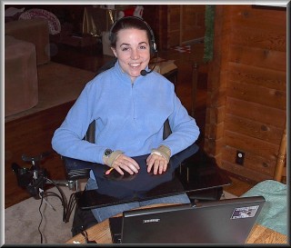 girl in blue sweater using asiistive technology